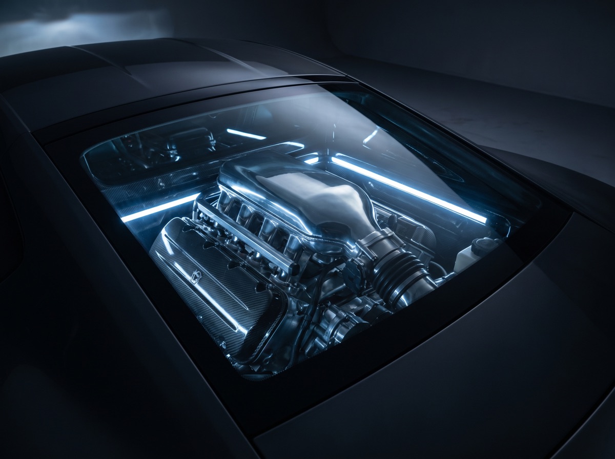 A mid-mounted engine under a glass cover